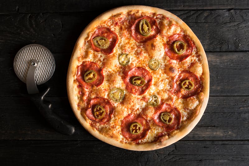 Margherita Classica pizza with fresh tomatoes and basil